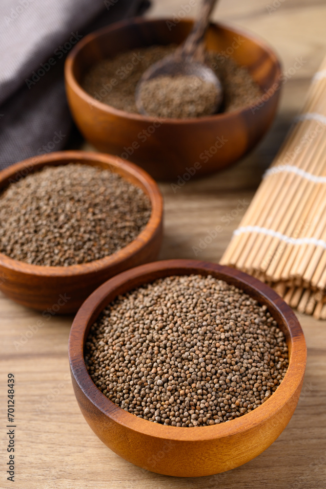 Perilla seed in wooden bowl, Healthy herbal seed ingredients in Asian food Perilla seed in wooden bowl, Healthy herbal seed ingredients in Asian food