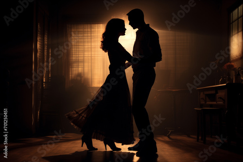 Charming dance of couple in the dimly lit room