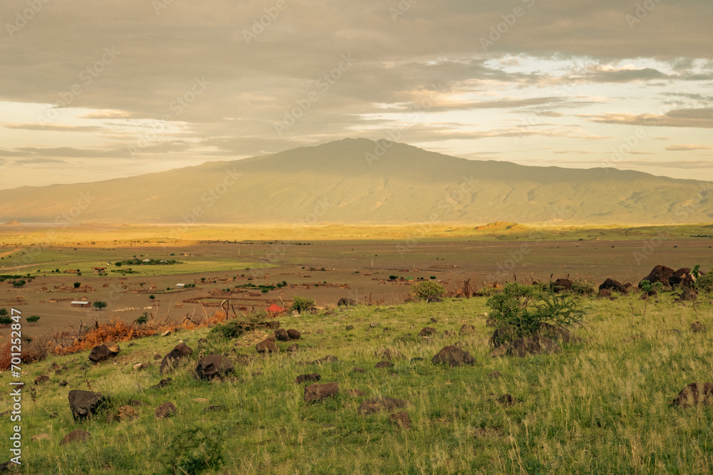View of masai villages at the foothills of Mount Ol Doinyo Lengai in Tanzania