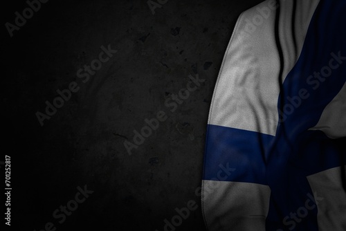 nice national holiday flag 3d illustration. - dark picture of Finland flag with big folds on black stone with empty place for your content photo