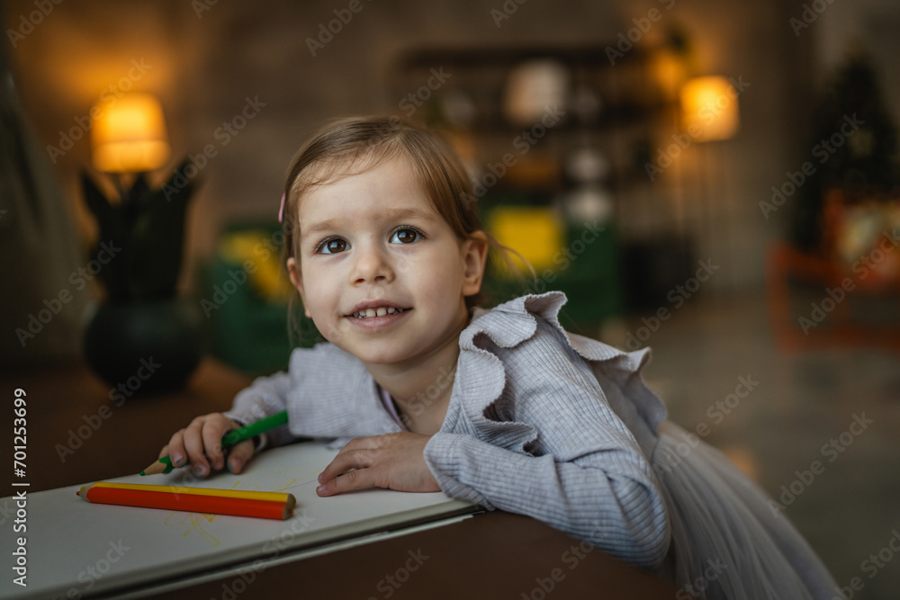 Toddler girl caucasian child play with crayons at home Toddler girl caucasian child play with crayons at home