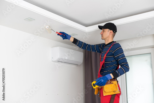 Construction worker installation ceiling work