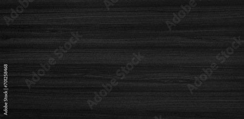 beautiful dark black walnut wooden texture with horizontal veins. luxury interior material wood texture background. lining boards wall. dried planks show beautiful wooden grain.