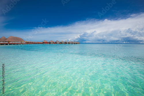 Maldives paradise island. Tropical aerial landscape, seascape long jetty pier water villas. Amazing sea sky sunny lagoon beach, tropical nature. Exotic tourism destination popular summer vacation 