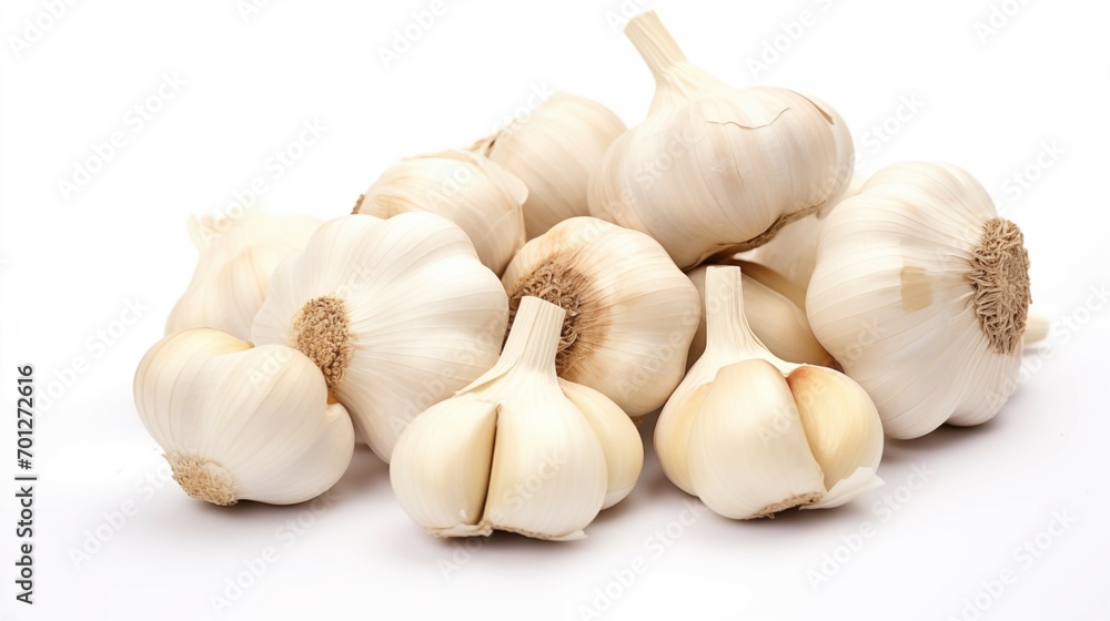 Healthy diet. Vegetables. A handful of garlic on white background. Isolated Healthy diet. Vegetables. A handful of garlic on white background. Isolated