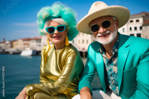 Man and woman in matching outfits sitting on boat.