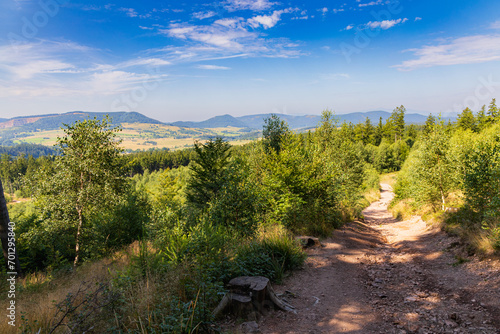 Beautiful green yellow and blue landscape in mountains seen from long and steep mountain trail