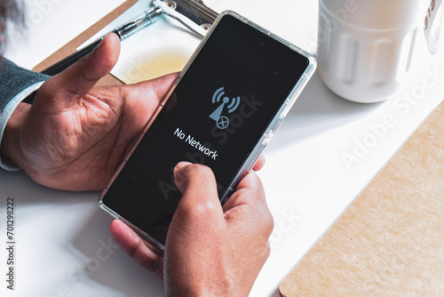 Mobile phone displaying no network message.