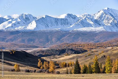 Mountain landscape. Mountain peaks covered with snow in autumn.