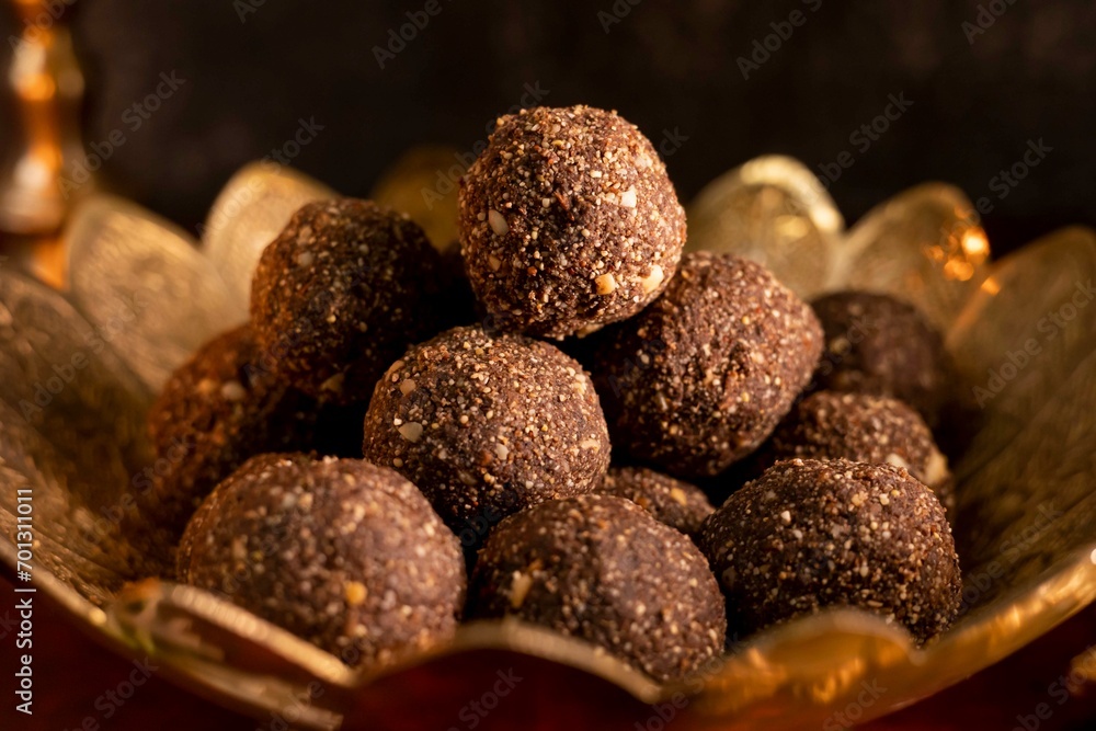 Discover the decadence of chocolate laddus in this HD image. Perfect for confectionery ads, festive themes, or any project needing a touch of sweet luxury. Discover the decadence of chocolate laddus in this HD image. Perfect for confectionery ads, festive themes, or any project needing a touch of sweet luxury.
