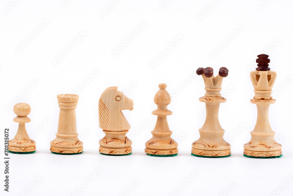 Wooden chess pieces on a white background Wooden chess pieces on a white background