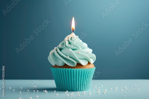 Birthday candle on a cupcake, in the style of light sky-blue and dark white.