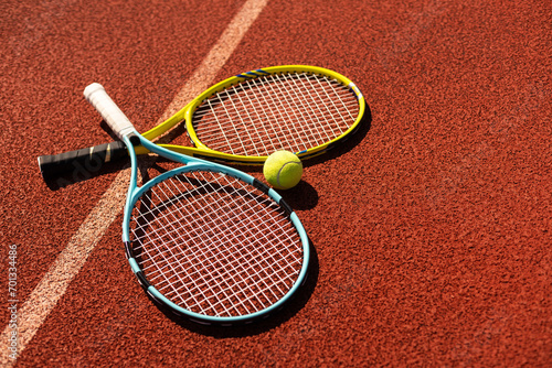 Tennis ball and tennis racket. © Angelov