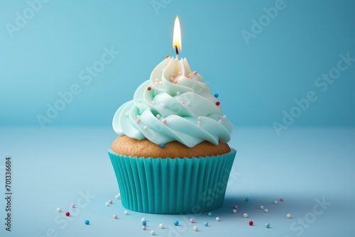 Birthday candle on a cupcake, in the style of light sky-blue and dark white.