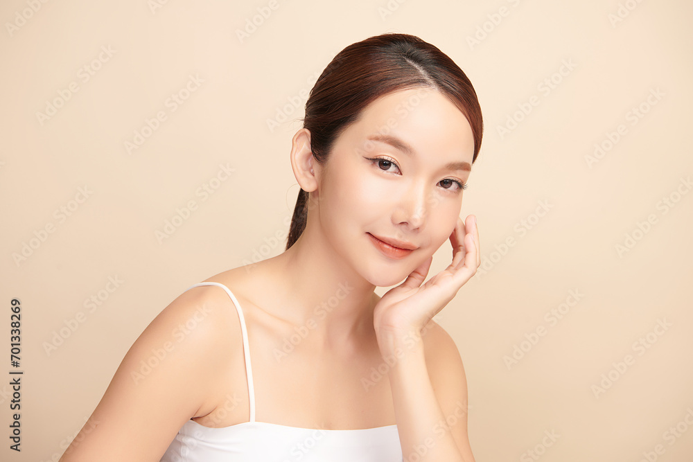 Beautiful young asian woman with clean fresh skin on beige background, Face care, Facial treatment, Cosmetology, beauty and spa, Asian women portrait. Beautiful young asian woman with clean fresh skin on beige background, Face care, Facial treatment, Cosmetology, beauty and spa, Asian women portrait.