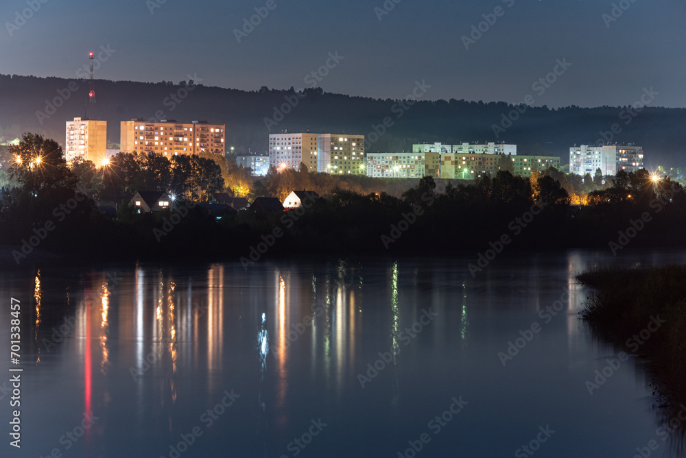 View of the city at night. Urban landscape. City by the river.