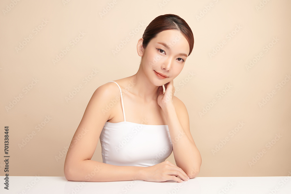 Beautiful young asian woman with clean fresh skin on beige background, Face care, Facial treatment, Cosmetology, beauty and spa, Asian women portrait. Beautiful young asian woman with clean fresh skin on beige background, Face care, Facial treatment, Cosmetology, beauty and spa, Asian women portrait.