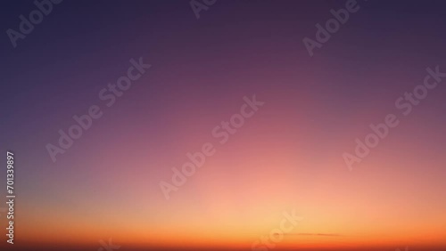 Vibrant hues emerge as the sun's golden rays pierce through swiftly moving clouds, painting the sky with breathtaking colors in this fast time-lapse. Timelapse.
