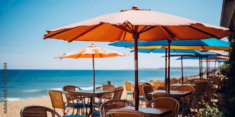 A seaside cafe with colorful umbrellas and ocean views , seaside cafe, colorful umbrellas, ocean views.