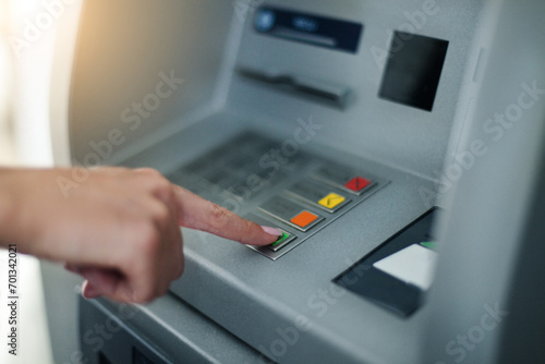 Woman using banking machine