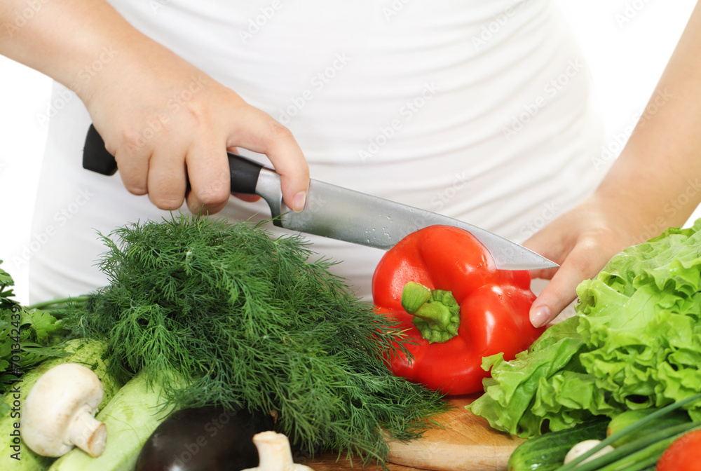 Woman's hands cutting vegetables