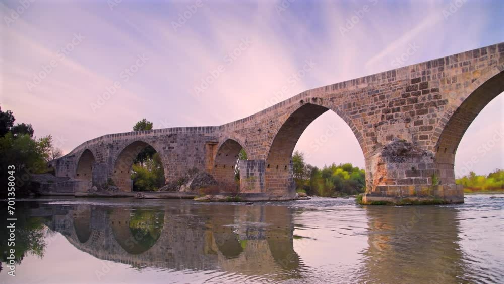 The historical Aspendos Bridge over river at sunrise in Antalya Turkey The historical Aspendos Bridge over river at sunrise in Antalya Turkey