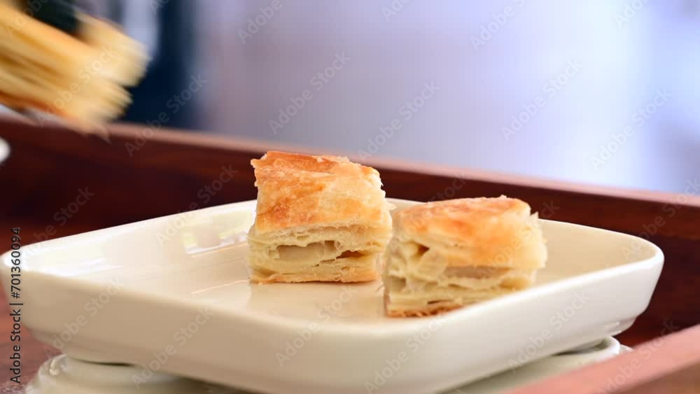 Chef puts Kurt pastry on a white porcelain plate Chef puts Kurt pastry on a white porcelain plate