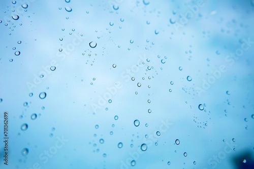 Rain drop on glass with blue sky background, wallpaper, bubbles, natural, water 
