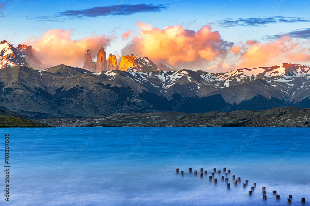 Torres del paine during sunrise with lake in foreground 