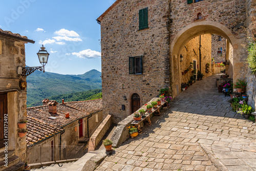 The beautiful village of Castelnuovo Val di Cecina on a sunny summer morning. Province of Pisa, Tuscany, Italy.  photo