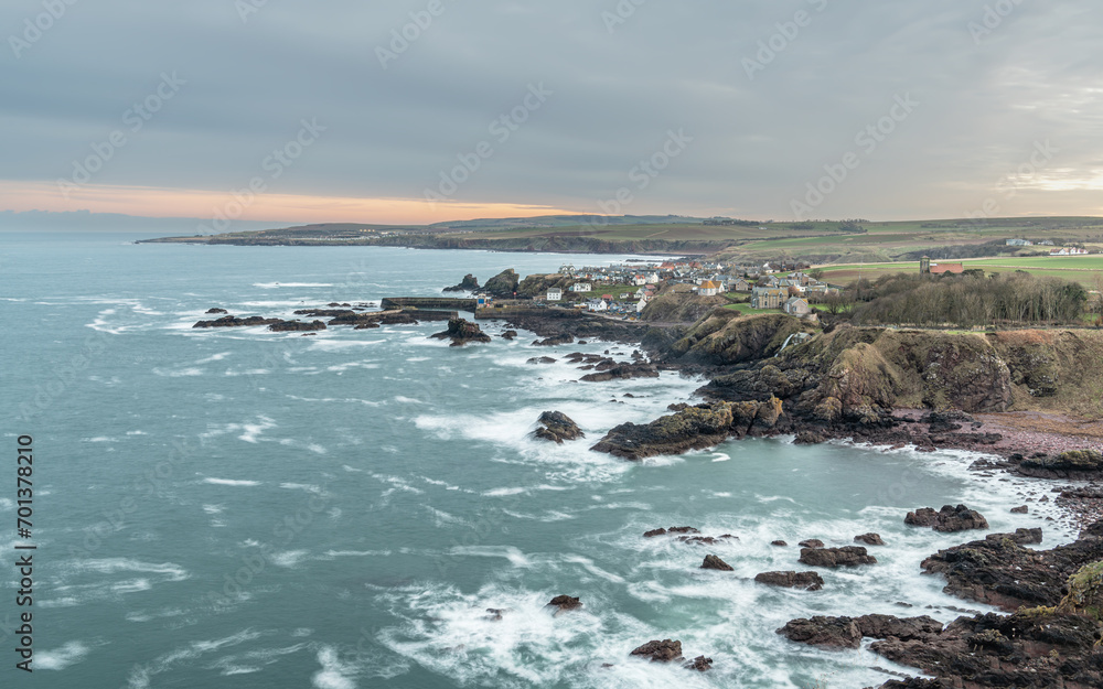 Long exposure of the sea, rocky coastline, Town and Harbour, St Abbs, Scotland