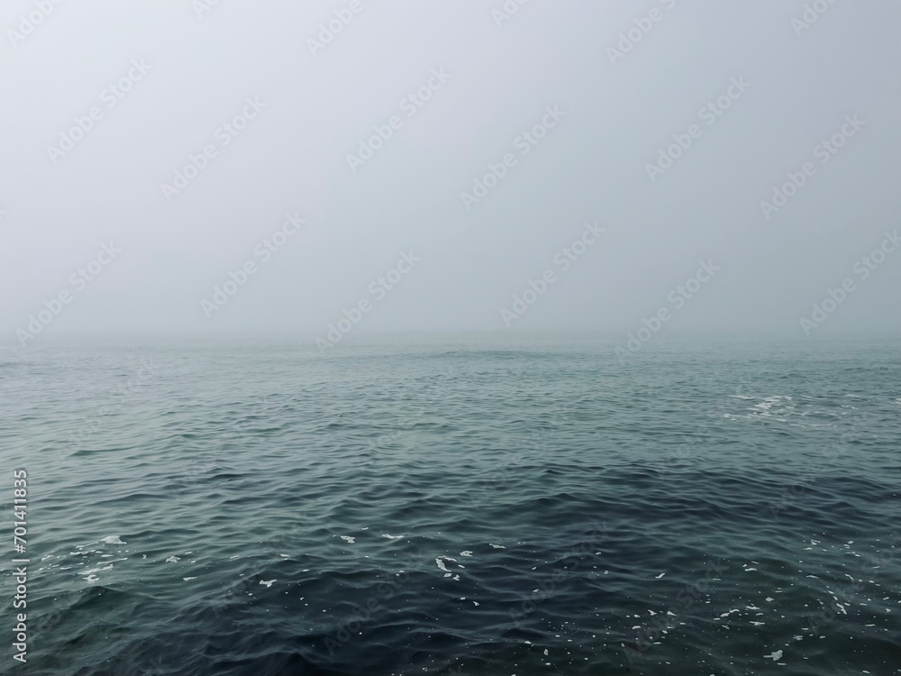 Foggy sea horizon, mist at the sea, mysterious seascape Foggy sea horizon, mist at the sea, mysterious seascape