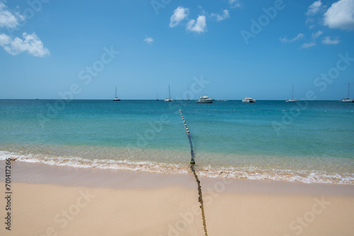 Fishing nets stretch put into the Caribbean sea from Reduit beach