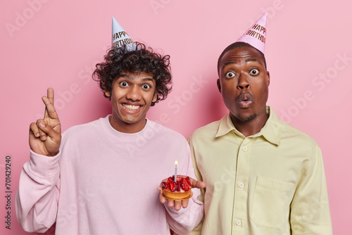 Wall Mural Studio photo of young happy smiling Hindu and surprised African american men cel