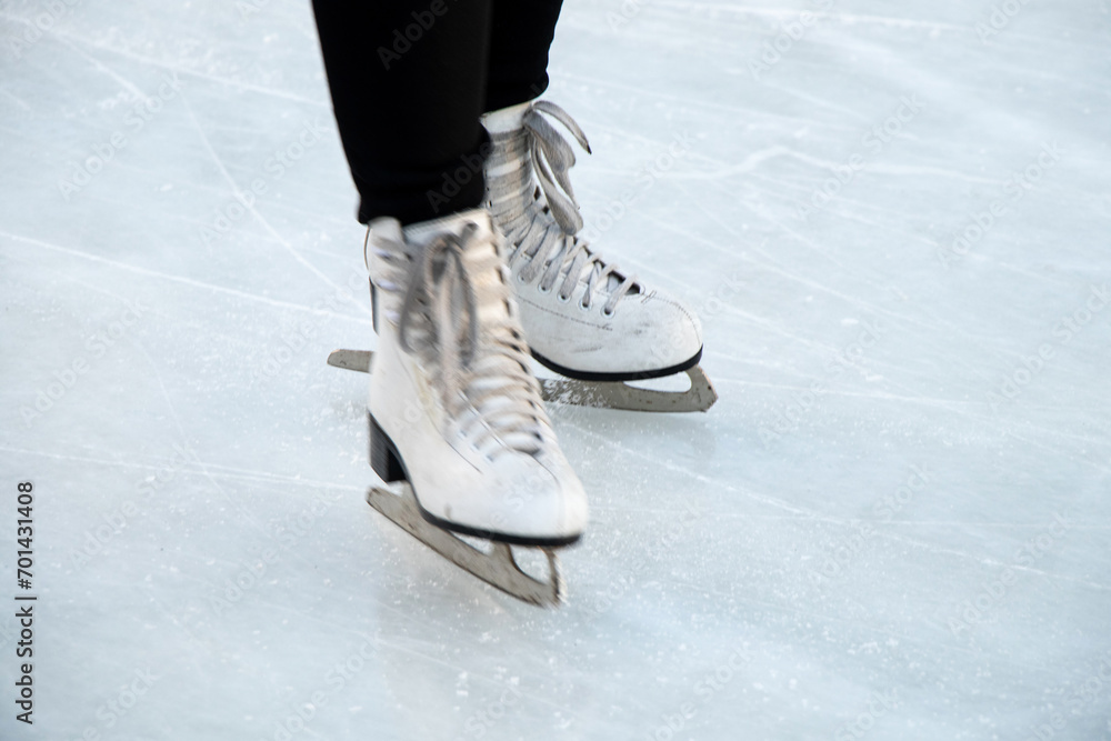 A girl skates on ice outdoors in December in Ukraine A girl skates on ice outdoors in December in Ukraine