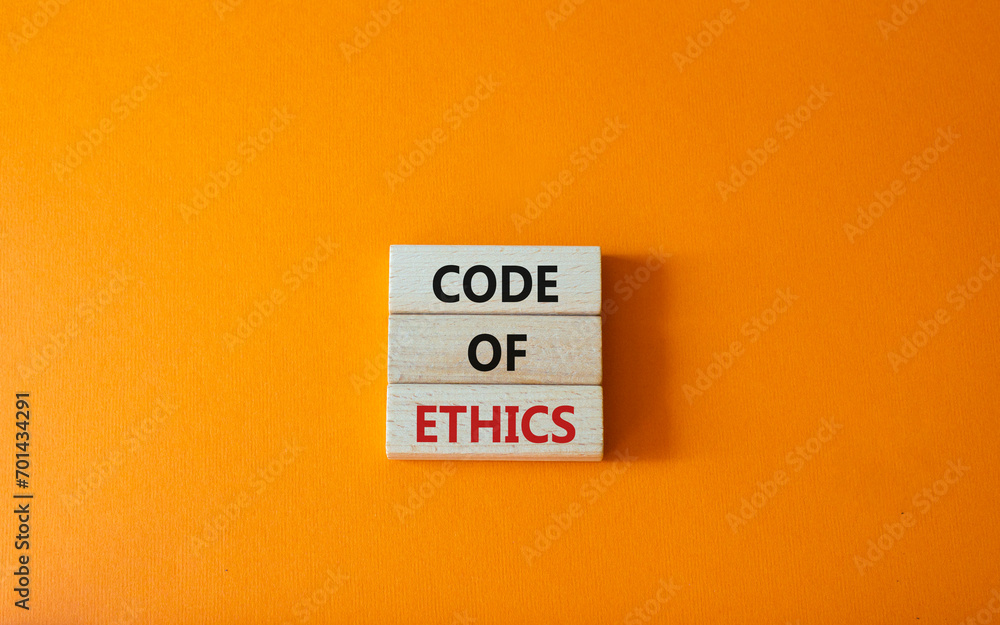 Code of ethics symbol. Concept words Code of ethics on wooden blocks. Beautiful orange background. Business and Code of ethics concept. Copy space. Code of ethics symbol. Concept words Code of ethics on wooden blocks. Beautiful orange background. Business and Code of ethics concept. Copy space.