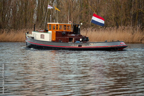 Typical boat on the river in the Netherlands. 
