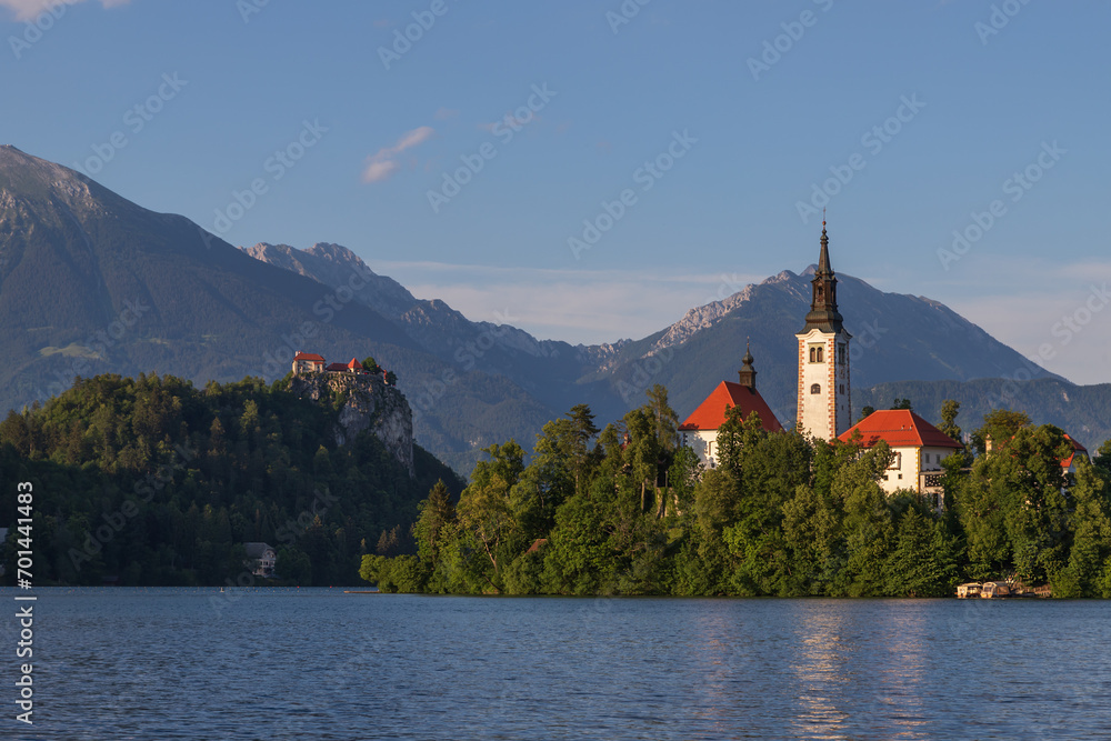 Church of the Assumption of the Virgin Mary on an island near Lake Bled in Slovenia. There are beautiful clouds in the sky.
