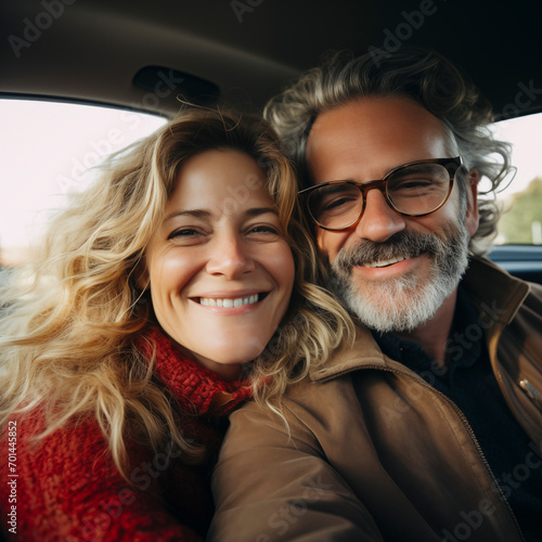 Happy couple having fun on new car - Mature people enjoying time together during traveling vacation - Travel lifestyle and transportation concept © simona