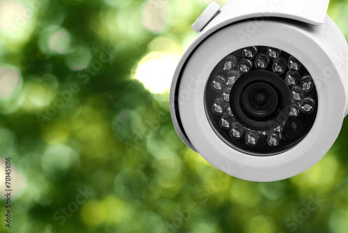 Modern security CCTV camera outdoors, closeup. Space for text