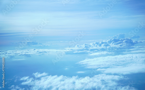 Fototapeta Naklejka Na Ścianę i Meble -  Floating clouds following the wind viewed from airplane height