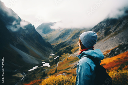 Hiker on a mountain from the back