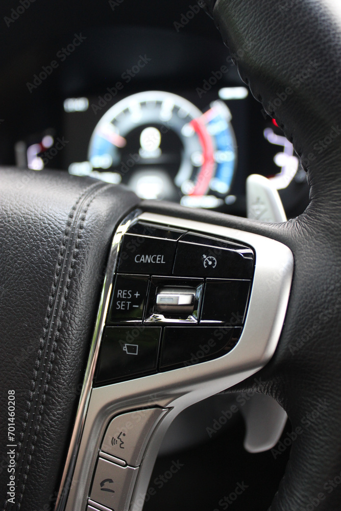 Block of control buttons for vehicle systems on the right side of the steering wheel

