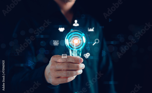 Digital marketing solution communication and Global Internet network connection concept. Businessman holding light bulb, Application smartphone, Sales Strategy, big data, Research finance analyst.