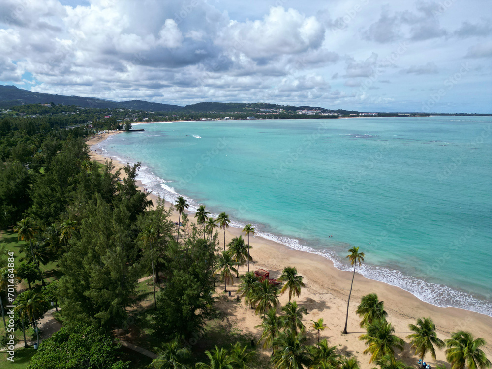 luquillo beach with ocean water, sand and palm trees (resort town in puerto rico) atlantic, caribbean travel destination (from above, drone, panoramic) coastline, paradise