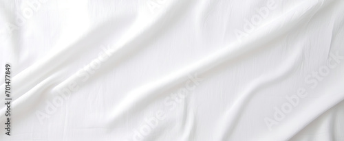 A Close-Up of a White Sheet on a Bed