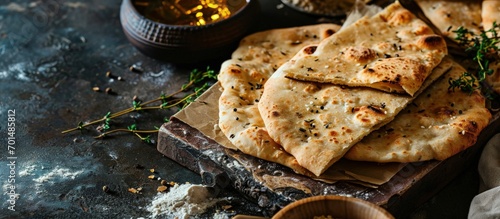 Mini traditional Shami flat bread with wheat and flour small Aish Shamy or small pita bread baked in extremely hot ovens it is the result of a mixture of wheat flour yeast salt and water photo