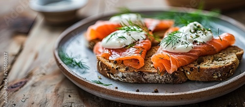 smoked salmon sandwich with cream fresh and dill on white plate. Creative Banner. Copyspace image