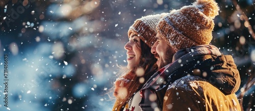 Young couple playing outdoors Winter season. Creative Banner. Copyspace image