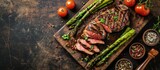 Medium rare grilled Tomahawk beef steak with asparagus Flat lay with copy space. Creative Banner. Copyspace image